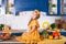 Smiling little girl sitting on work surface of kitchen waiting for breakfast. Cheerful and mischievous girl in kitchen. Healthy nu