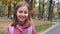 Smiling little girl walking after school