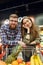 Smiling Loving couple standing near the shopping trolley