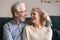 Smiling loving middle aged man and woman enjoying romantic moment