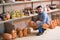 Smiling male artisan having ceramics in workroom