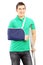 Smiling male with broken arm and crutch