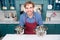 Smiling male chef cook holding pans