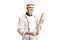 Smiling male chef in a uniform holding a loaf of baguette bread