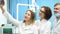 Smiling male and female doctors in uniform making selfie. Young dentists making a photo in the dental clinic cabinet.