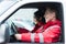 smiling male and female paramedics sitting