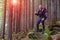 Smiling Male Hiker Staying in Dense Old Forest