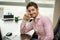 Smiling male office worker at desk working