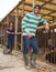 Smiling male proffesional farmer standing at chicken house