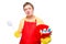 Smiling man in an apron holding a bucket with cleaning agents