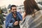 Smiling man is drinking tea with woman