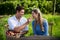 Smiling man feeding apple to girlfriend