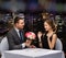 Smiling man giving flower bouquet to woman