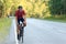 Smiling man in helmet enjoying road cycling