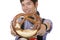 Smiling man holding Oktoberfest pretzel