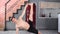 Smiling man with perfect slim body practicing yoga exercise at home looking at camera full shot