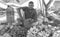 A Smiling Man Selling Fruits at Beach Side