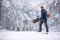 Smiling man with ski mask holding his snowboard, extreme sport a