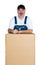 Smiling man standing over large cardboard box