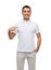 Smiling man in t-shirt pointing finger on himself
