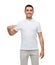 Smiling man in t-shirt pointing finger on himself