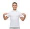 Smiling man in t-shirt pointing fingers on himself