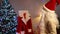 Smiling man in white beard eyeglasses and New Year hat looking back at Santa coat turning looking at camera gesturing