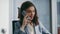 Smiling manager answer call sitting luxury office close up. Woman talking phone.