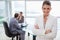 Smiling manager standing in conference room