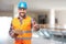 Smiling manual worker in blue helmet gesture thumb up