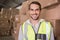 Smiling manual worker in warehouse