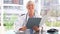 Smiling mature doctor looking at documents