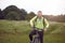 Smiling mature man wearing sportswear on bicycle