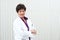 Smiling mature professional woman in labcoat