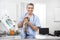 Smiling Mature Veterinarian Examining Weasel In Clinic