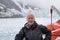 Smiling mature woman, cruise glaciers icebergs