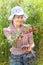 Smiling mature woman harvests cherry berries