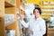 Smiling mature woman seller standing in pharmacy