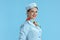 smiling modern flight attendant woman on blue