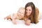 Smiling mother and baby together on white background