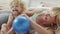 Smiling mother with blonde curly haired daughter child, preschool learning activity at home, concept of healthy growing,