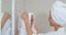 Smiling mother drying her daughters hair with towel