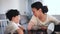 Smiling mother emotionally talking with tween son in home interior