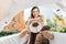 smiling mother holding teddy bear