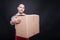 Smiling mover man holding big cardboard box