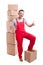 Smiling mover man showing like standing around boxes