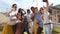 Smiling multi-ethnic friends taking selfie on the rooftop terrace