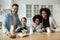 Smiling multicultural family with kids baking together