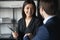 Smiling multiracial business partners handshake greeting at meeting