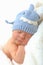 Smiling newborn baby in shark hat